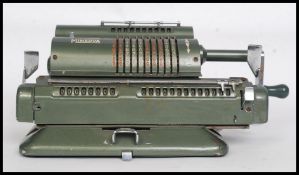 A vintage original industrial Minerva early adding machine / calculator, in green.