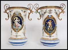 A pair of 19th century Gien Faience vases of waisted form again with gilt metal mounts and rococo
