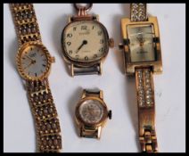 A collection of ladies dress watches being yellow gold to also include one with a 9ct gold strap /