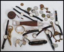 A collection of watches, vintage tape measure, whistles to include Amce Thunderer, brass paper clip,