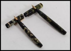 A vintage Swan Mabie Todd Ltd self filler green marble fountain pen,           with 14ct gold nib.