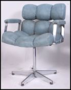 A retro 1970's chrome and blue vinyl upholstered officewivel chair.
