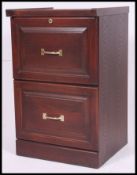 A late 20th century mahogany veneer two drawer office filing cabinet,