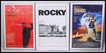 A collection of 3 film posters in aluminium frames.