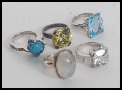 A collection of 5 contemporary silver ladies dress rings with oversized stones.