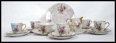 A 20th century Czech lusterware tea service to include cups,