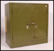 A vintage mid century industrial steel locker, with steel twin door  shelving to the interior,