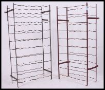 A pair of vintage folding / metamorphic metal work wine racks,