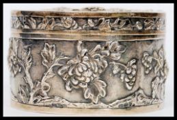 A Chinese silver powder box, maker Wang Hing & Co?, Hong Kong: of circular form,