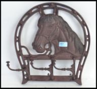 A metal hanging horse themed coat rack / cup rack.