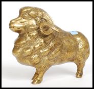 A decorative large brass figurine of a Ram ( see illustrations ) H19cm