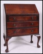 A vintage early to mid century oak bureau,