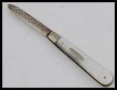 A Victorian silver hallmarked mother of pearl fruit knife - pen knife.