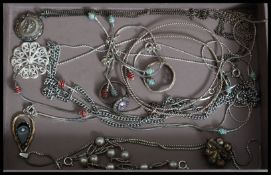 A collection of silver and white metal necklaces to include 925 silver pendant, filigree etc.