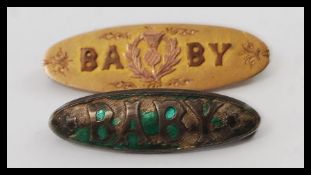 A 9ct gold sweetheart brooch ' Baby ' brooch together with a silver hallmarked enamel set Baby