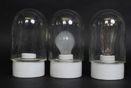 A set of 3 Industrial dairy lights - bulkhead lamps with ceramic fittings and glass shades.