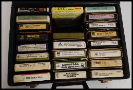 A collection of vintage 8 track cassettes to include Beach Boys, Neil Diamond, Diana Ross,
