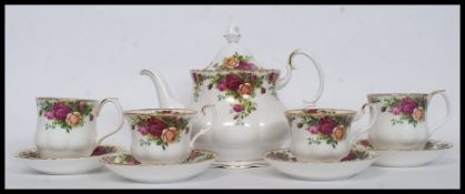 A Royal Albert Old Country Roses tea service comprising teapot, cups, saucers,