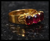 A stunning 22ct gold ( high carat ) 3 stone ruby ring.