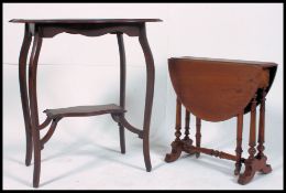 A late 19th early 20th century lamp table along with a similar aged Edwardian Sutherland table on