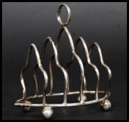 A hallmarked for Birmingham silver toast rack by G F Westwood & Sons having a date letter A