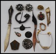A mixed collection of items to include; a Siam Sterling marked letter opener,