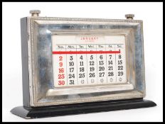A silver hallmarked Asprey of London desk top calendar. Hallmarks for London 1990.