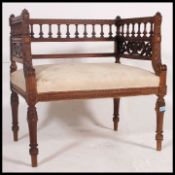 An early 20th century carved walnut Italian window seat.
