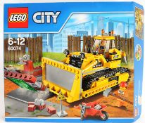 LEGO: A Lego City 60074 set Bulldozer.