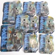 TRON: A collection of 9x Tron Legacy action figures by Spin Master Toys - each sealed,