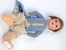 DOLL: An antique ' A7S ' composition headed and bodied doll. With sleeping eyes, original clothing.