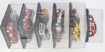 WORLD RALLY: A collection of 11x 1:43 scale diecast model World Rally Championship cars - each