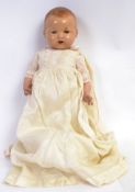 DOLL: A 1920's composition headed and bodied German made doll,
