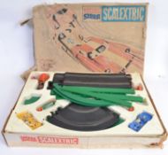 SCALEXTRIC: An original vintage Scalextric ' You Steer ' racing set, within the original box.