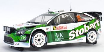 SUN STAR: An original 1:18 scale diecast model Sun Star Ford Focus WRC car, in Eddie Stobart livery.