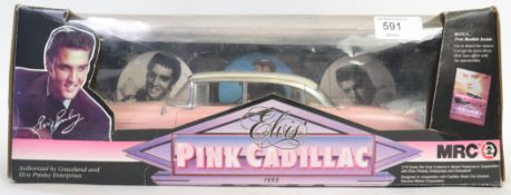 ELVIS: A 1:18 scale MRC Elvis Pink Cadillac diecast model car, within the original box.
