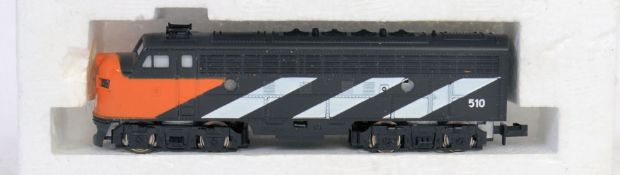 TRIX: A Trix Railways N Gauge ' 510 ' orange and black locomotive.