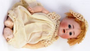GERMAN DOLL: An antique German doll - marked to rear of neck ' AB (?) ' ' 1352 / 23 ' Made In
