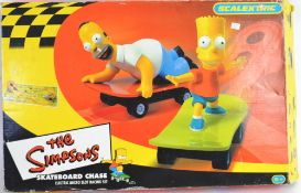 SCALEXTRIC: An original Scalextric Simpson Skateboard Chase racing set, appearing to be little used,