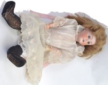 HEUBACH KOPPELSDORF: An antique Heubach Koppelsdorf bisque headed, composition bodied doll.