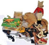TOYS & GAMES: A mixed lot of vintage toys and games to include vintage cap guns,