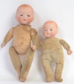 ARMAND MARSEILLE; Two antique small Armand Marseille bisque headed cloth bodied dolls.