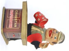 CRAGSTON CRAPSHOOTER: An original vintage Cragston Crapshooter battery operated tin plate croupier.