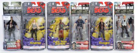 WALKING DEAD: A collection of 6x Walking Dead McFarlane Toys action figures, each sealed.