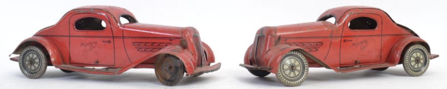 WOLVERINE TINPLATE: Two original c1936 Mystery Action tin plate clockwork cars.