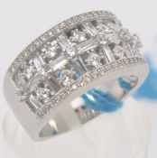 A ladies 925 silver cz stone pave set and cross over cocktail / dress ring. Total weight 7.