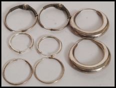 A collection of 4 sets of earrings.