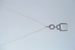 A silver CZ and opalite pendant necklace. Total weight 5.