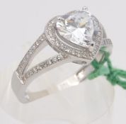 A silver and heart shaped cz ring. Total weight 3.