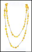 A 1930s Czech long mustard art glass bead necklace. Length 52 inches. Weight 60g.
